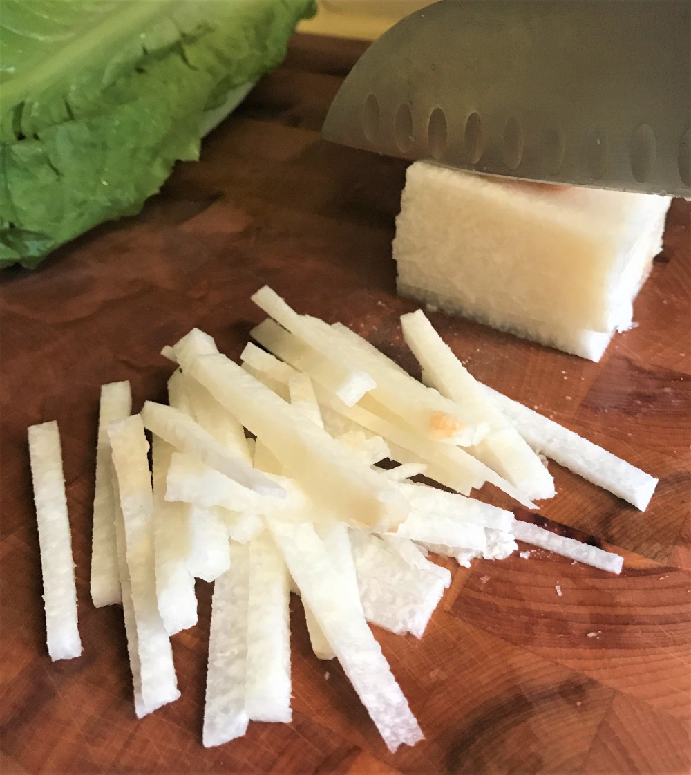 Cutting jicama into match sticks